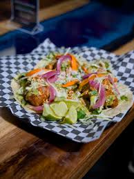 Azul Tacos and Beer signature dishes Tinga de Pollo TacosBaja Fish TacosStreet Corn Nachos